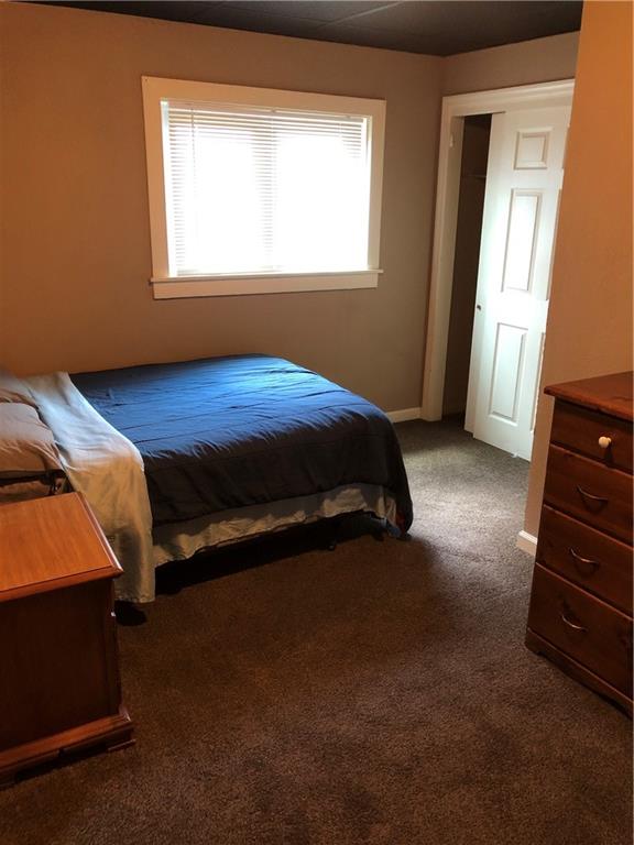 350 Jefferson Street Rochester, PA 15074 - Photo 4 of 19 a bed sitting in a bedroom next to a window