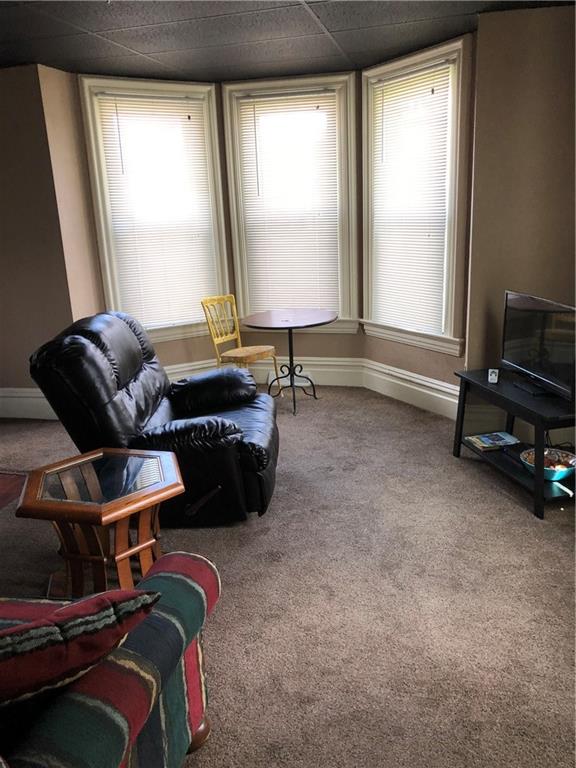 350 Jefferson Street Rochester, PA 15074 - Photo 6 of 19 a room with furniture and a window