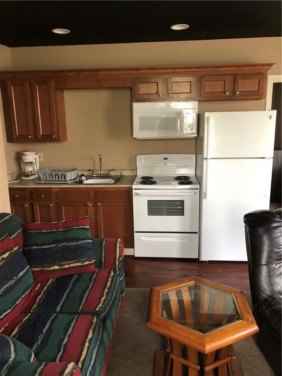 350 Jefferson Street Rochester, PA 15074 - Photo 7 of 19 a kitchen with a stove and a microwave