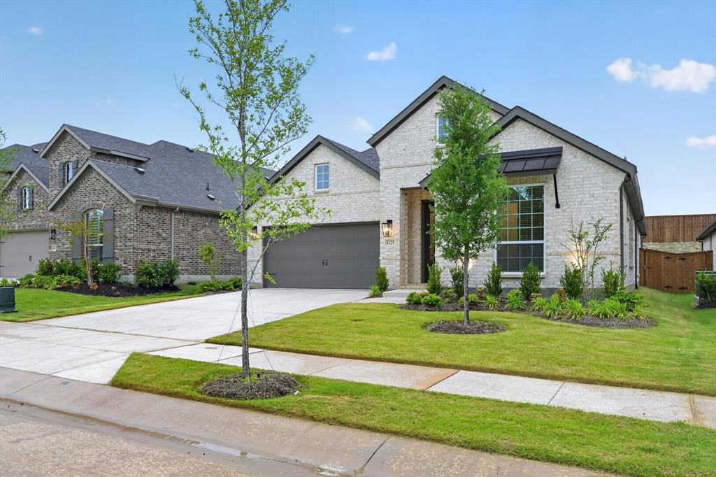 4123 Windy Point Court Oak Point, TX 75068 - Photo 9 of 29 Contemporary brick exterior with dark trim accents and a prominent front window