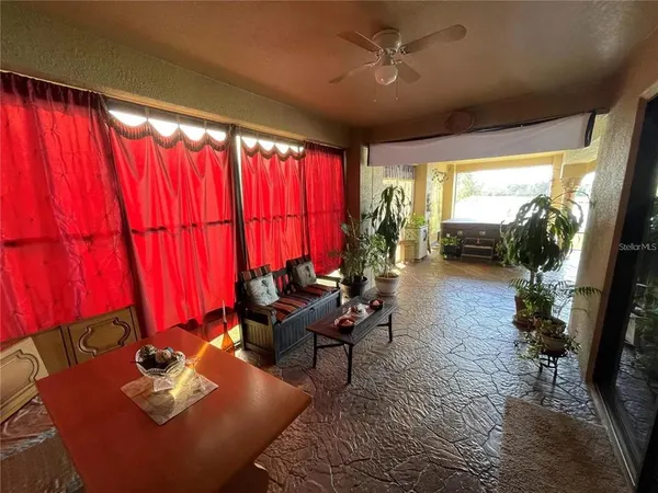 a living room with furniture and a window