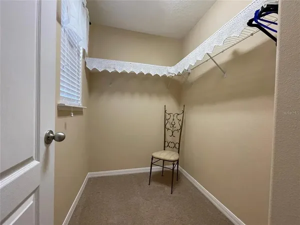 a bathroom with a window and a shower