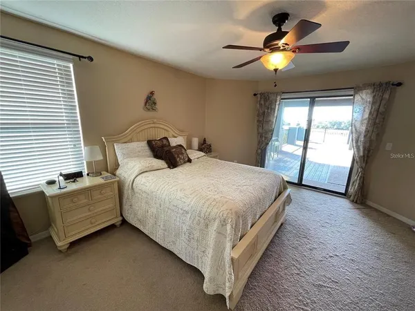 a bedroom with bed and window