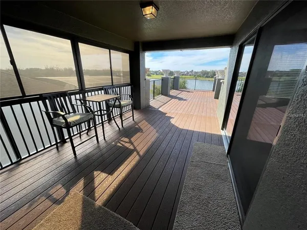 a view of a balcony with wooden floor