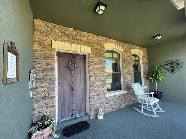 a front view of a house with chairs