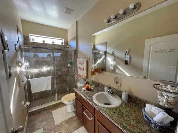a bathroom with a sink and mirror