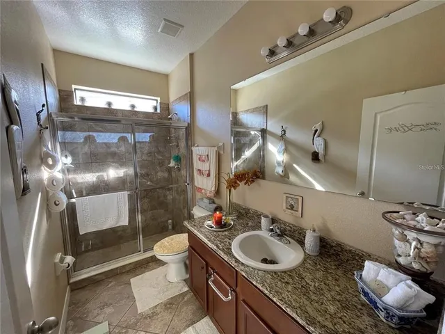 a bathroom with a sink and mirror