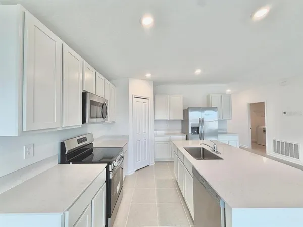 a view of a kitchen with a sink