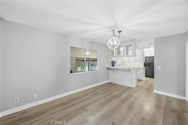 a bathroom with a sink toilet vanity and shower