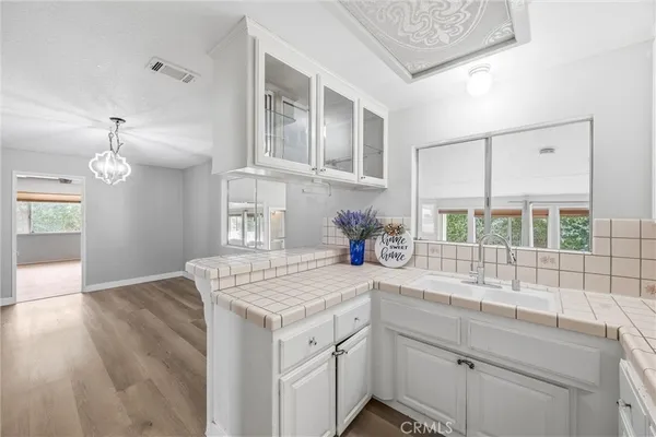 an empty room with a fan and a ceiling fan