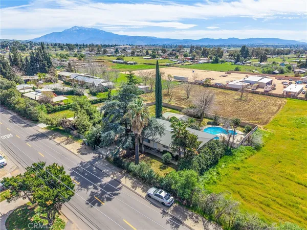 a view of a house with a yard and garage