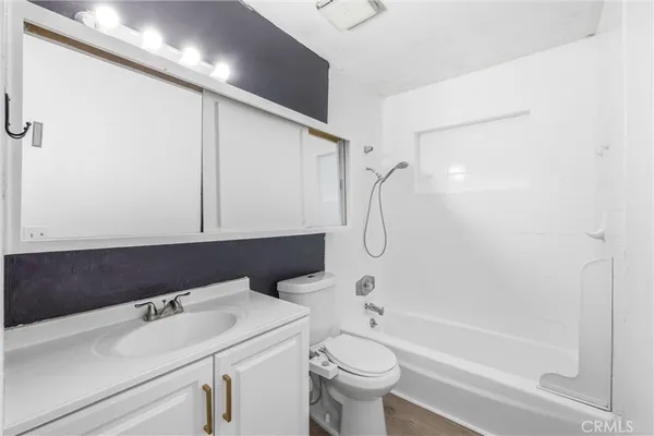 a living room with a fireplace and a large window