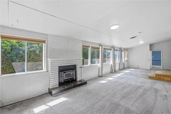 a view of a pathway of a back yard of the house