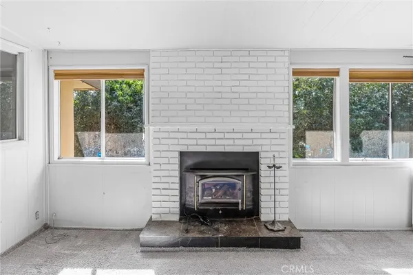 a view of a swimming pool with an outdoor seating