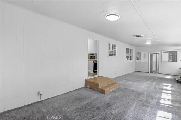 a swimming pool with outdoor seating and yard