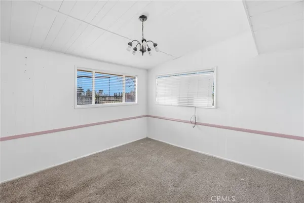 a house with swimming pool in front of it