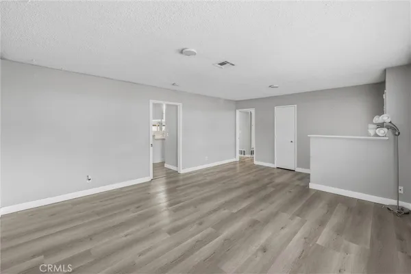 a kitchen with stainless steel appliances granite countertop a sink a refrigerator and a stove