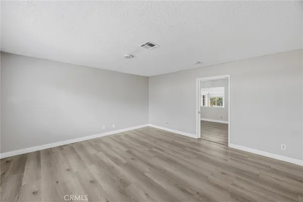 a kitchen with a sink refrigerator and cabinets
