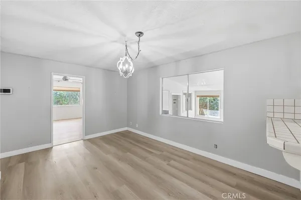 a kitchen with cabinets stainless steel appliances and counter space