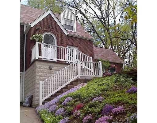 286 McCoy Road McKees Rocks, PA 15136 - Photo 1 of 18 Exterior Front. New Driveway.Vinyl Siding and Railings. Beautifuly Landscaped. Surrounded by Trees.