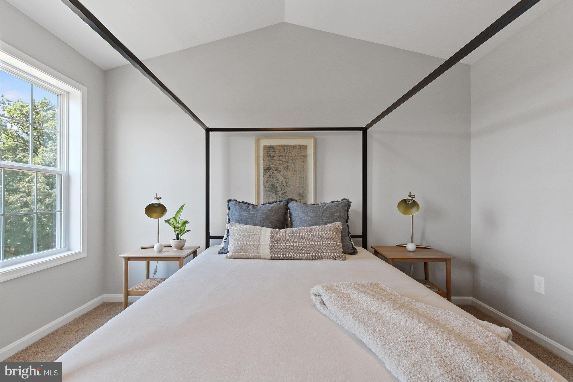 436 Bradford Drive, Unit 59 Red Lion, PA 17356 - Photo 20 of 43 a bedroom with a bed and wooden floor