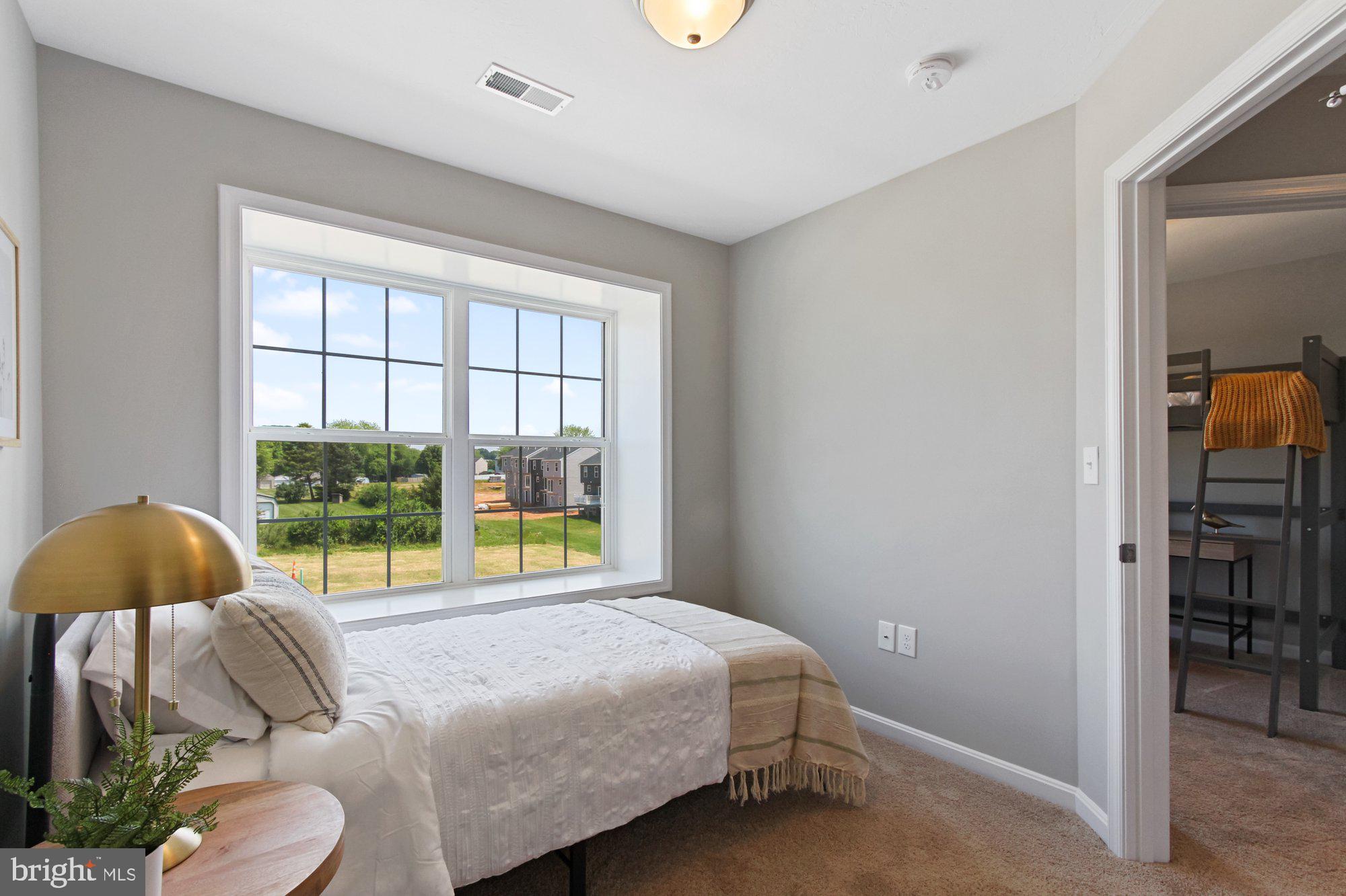 436 Bradford Drive, Unit 59 Red Lion, PA 17356 - Photo 30 of 43 a bedroom with a bed and a window