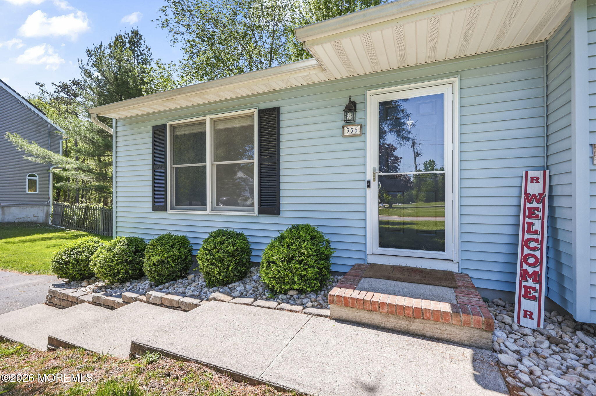 356 Leesville Road Jackson, NJ 08527 - Photo 9 of 46 a front view of a house with garden