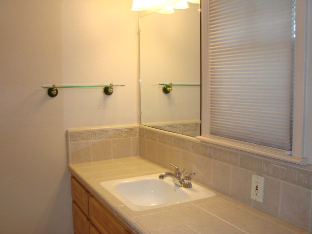 10790 Ridgeview Way San Jose, CA 95127 - Photo 11 of 25 a bathroom with a sink and shower