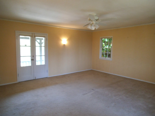 10790 Ridgeview Way San Jose, CA 95127 - Photo 15 of 25 an empty room with a chandelier fan and windows