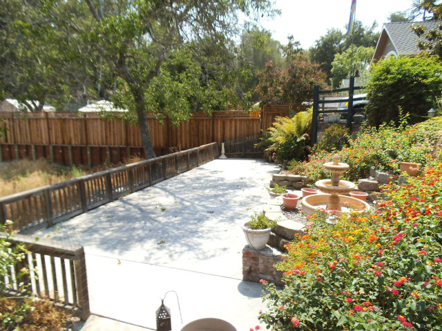 10790 Ridgeview Way San Jose, CA 95127 - Photo 20 of 25 a view of a small yard and flowers