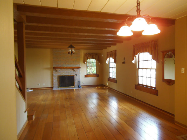 10790 Ridgeview Way San Jose, CA 95127 - Photo 2 of 25 a view of a livingroom with wooden floor a fireplace and window