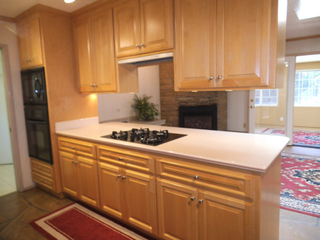 10790 Ridgeview Way San Jose, CA 95127 - Photo 7 of 25 a kitchen with granite countertop a sink cabinets and stainless steel appliances