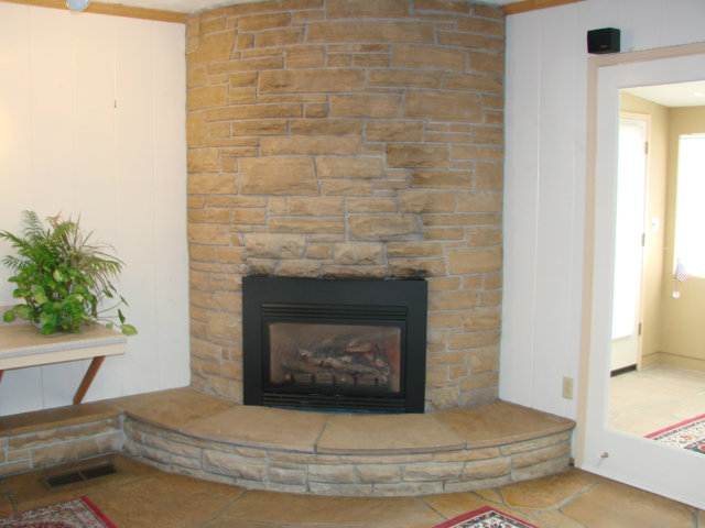 10790 Ridgeview Way San Jose, CA 95127 - Photo 9 of 25 a living room with a fireplace and a potted plant