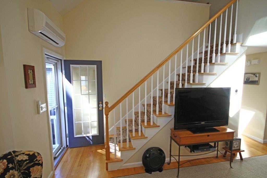 110 Spinnaker Ridge Drive, Unit 31 Wells, ME 04090 - Photo 18 of 39 15. Living to 2nd floor stairway