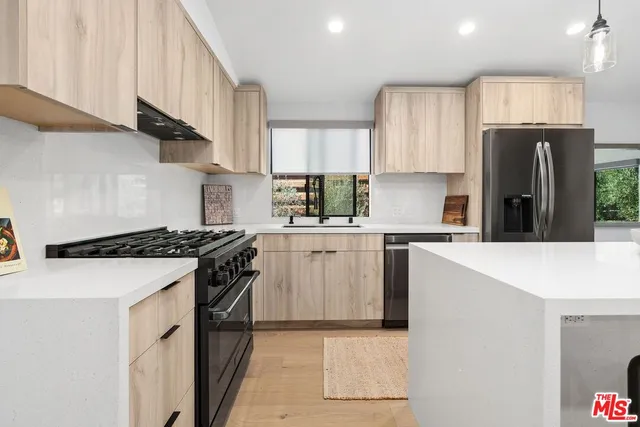 a view of kitchen with furniture and window