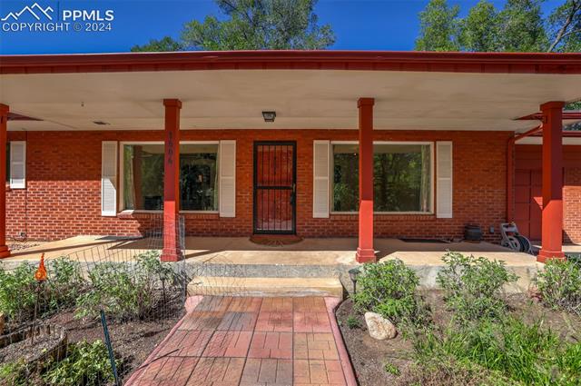 1404 West Cheyenne Road Colorado Springs, CO 80906 - Photo 17 of 50 Property entrance featuring a patio