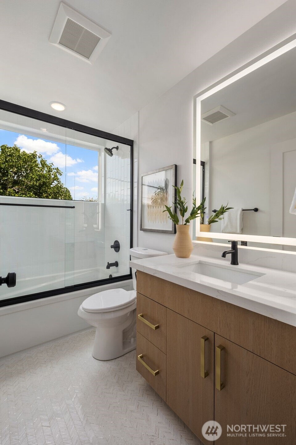 822 South Sullivan Street Seattle, WA 98108 - Photo 19 of 22 a bathroom with a double vanity sink toilet and a mirror