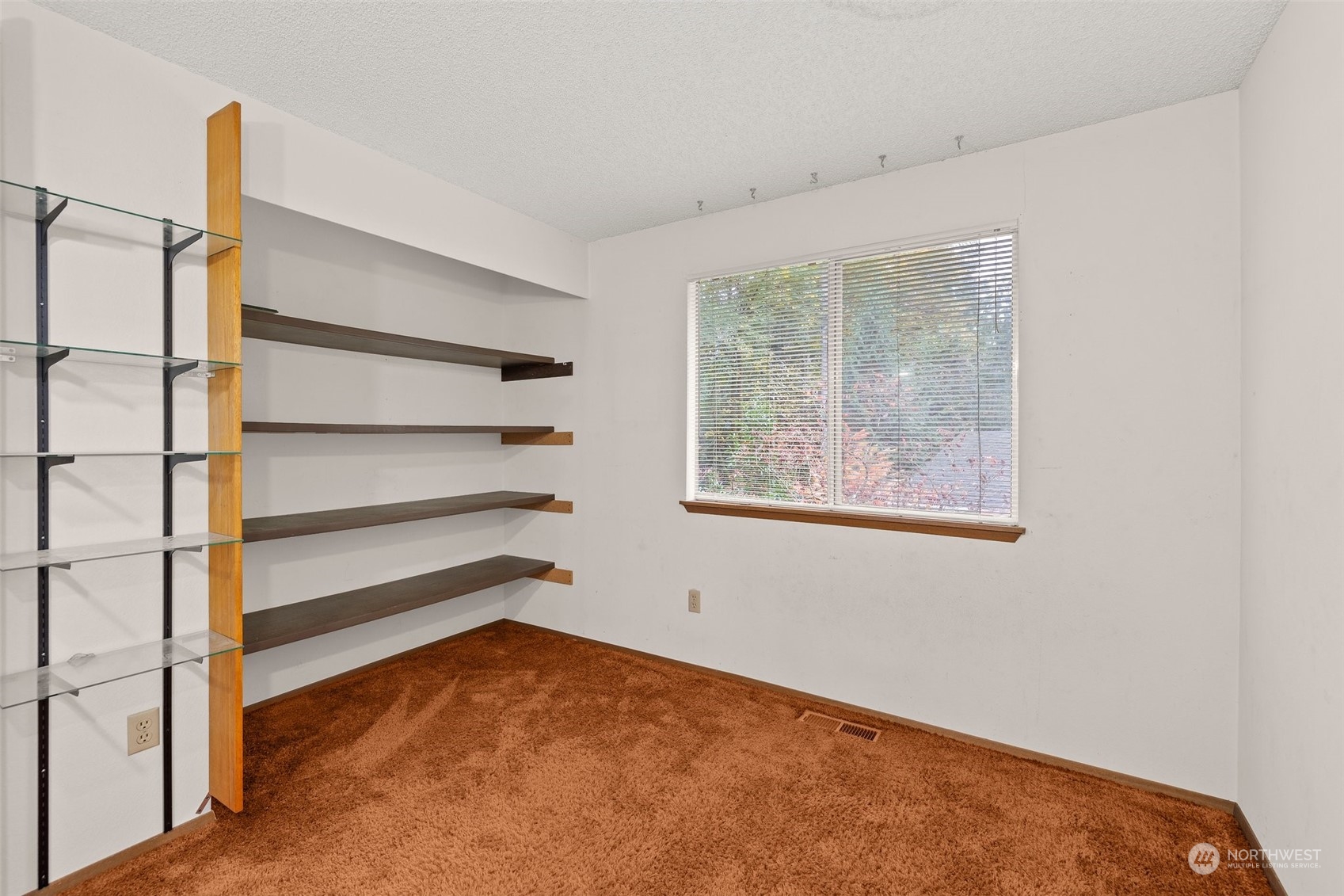 22929 38th Avenue Southeast Bothell, WA 98021 - Photo 17 of 38 a view of an empty room with a window