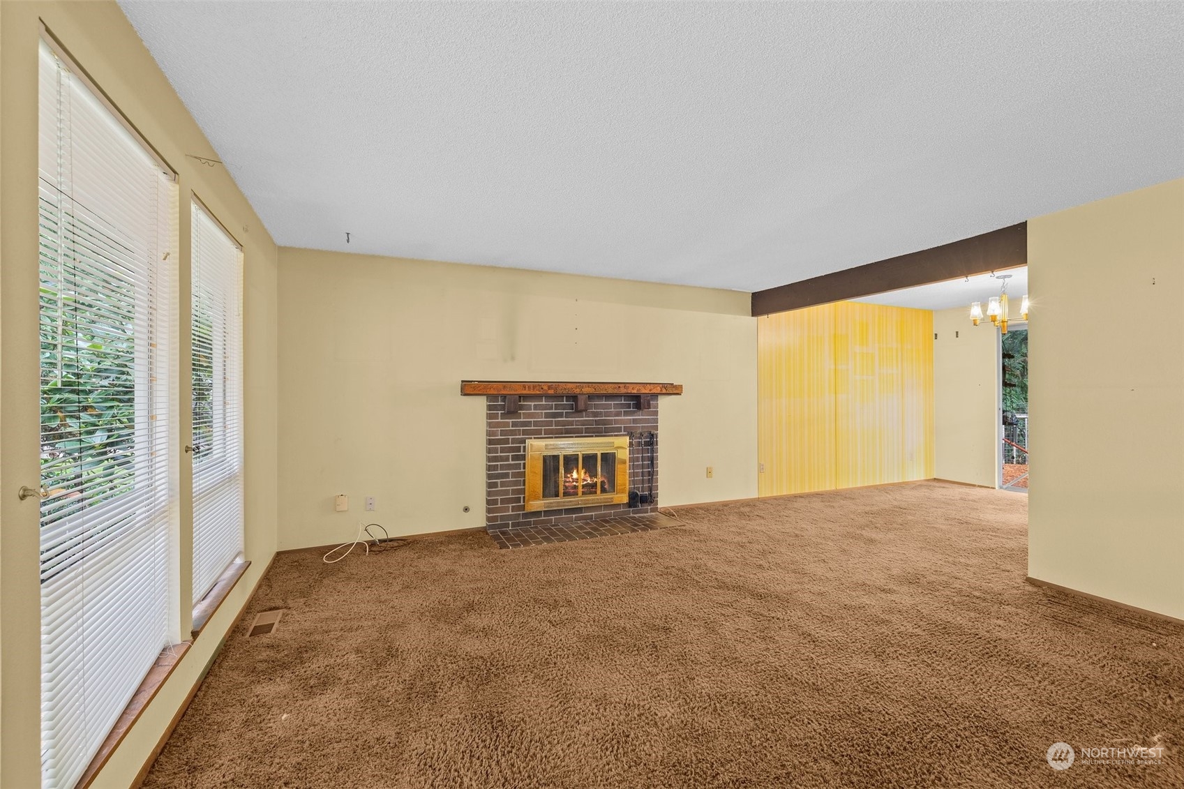 22929 38th Avenue Southeast Bothell, WA 98021 - Photo 4 of 38 a view of an empty room with a window and fireplace