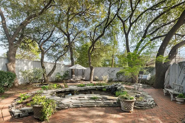a view of a house with backyard sitting area and swimming pool