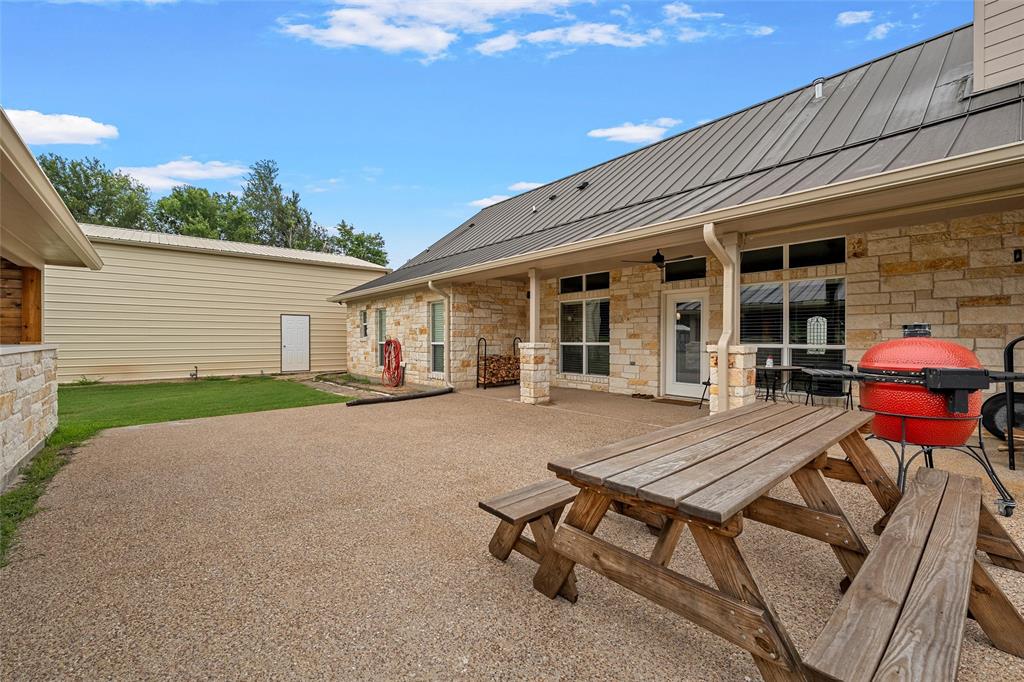 1117 Downsville Road Robinson, TX 76706 - Photo 26 of 40 Expansive stone-finish patio with a durable aggregate surface