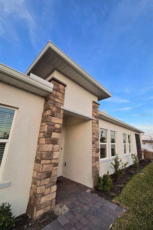 4246 St Thomas Way Kissimmee, FL 34758 - Photo 1 of 16 a front view of a house with a yard