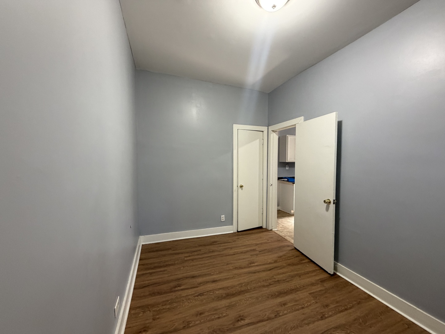 6006 South Marshfield Avenue, Unit 1 Chicago, IL 60636 - Photo 13 of 14 a view of a hallway with wooden floor