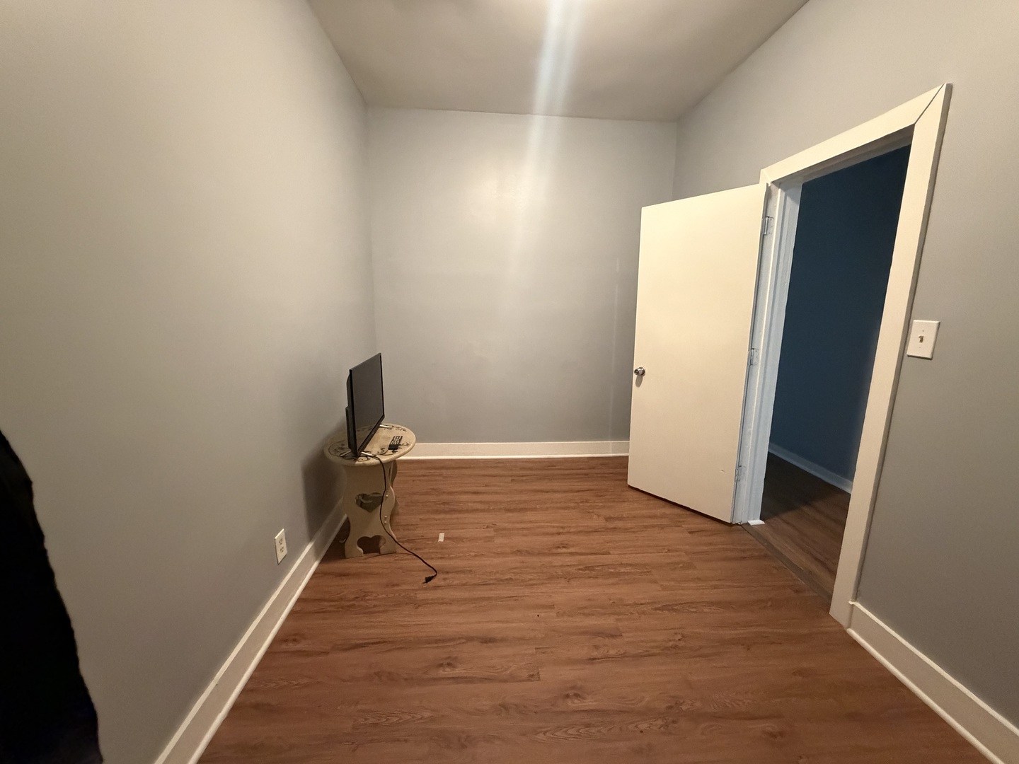 6006 South Marshfield Avenue, Unit 1 Chicago, IL 60636 - Photo 8 of 14 a room with wooden floor and bathroom