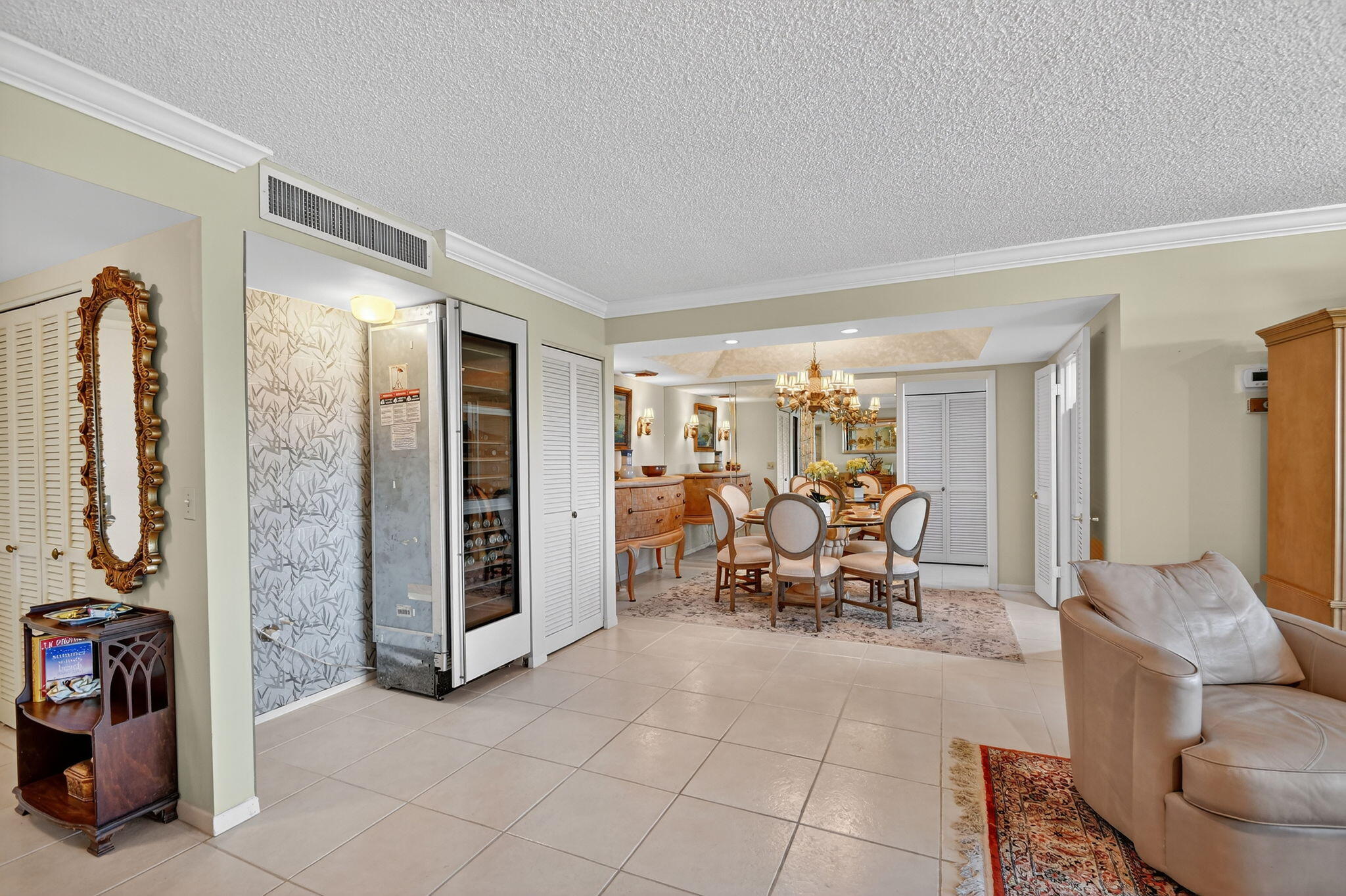 3589 South Ocean Boulevard, Unit 608 South Palm Beach, FL 33480 - Photo 13 of 66 a living room with furniture and a flat screen tv