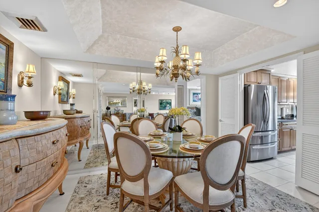 a bedroom with a bed a dresser next to a window