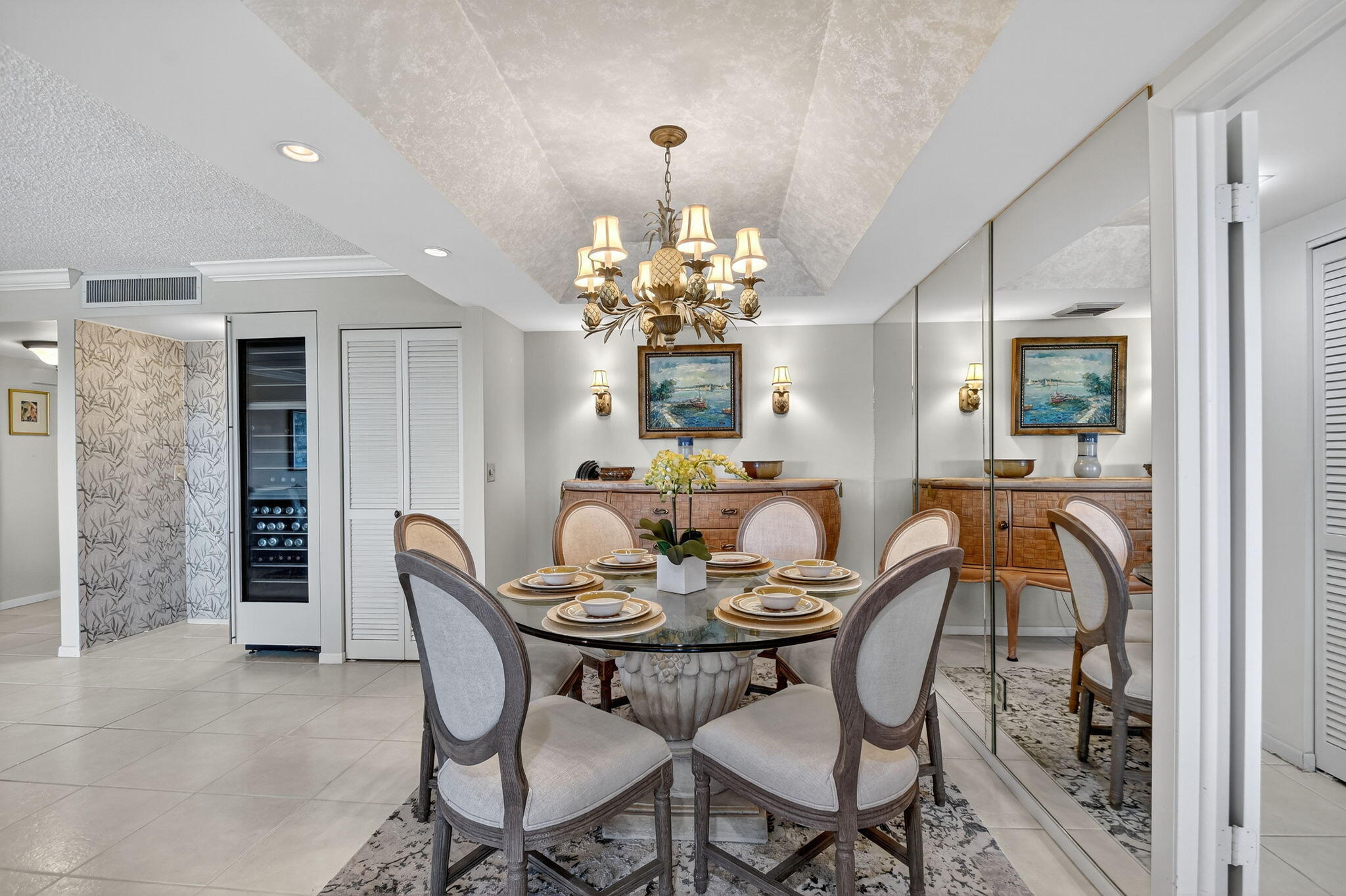 3589 South Ocean Boulevard, Unit 608 South Palm Beach, FL 33480 - Photo 16 of 66 a view of a dining room with furniture and chandelier