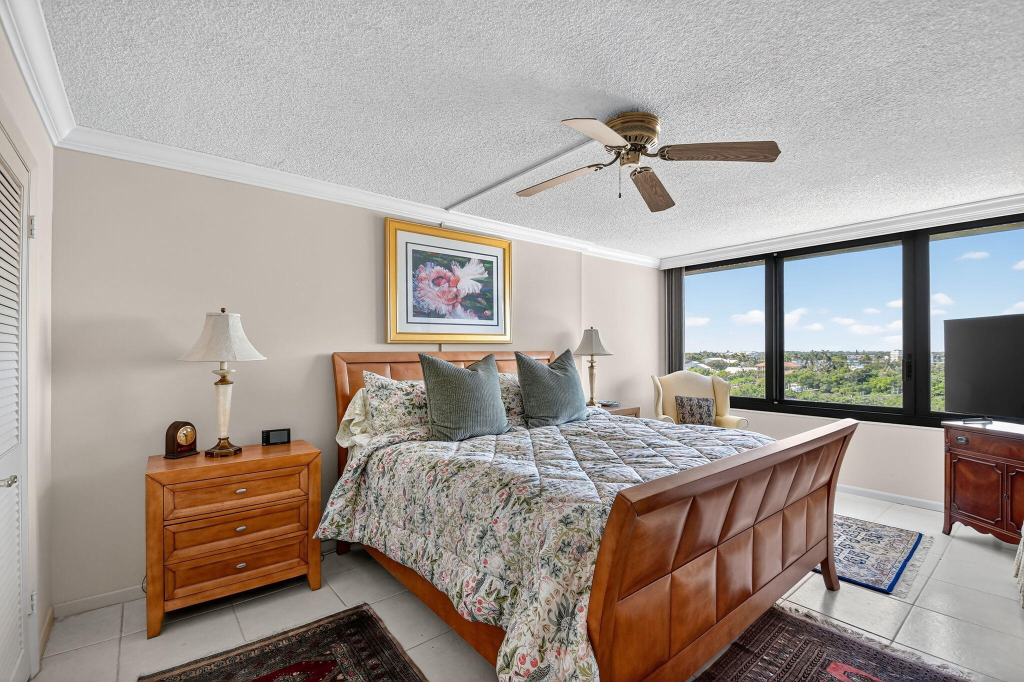 3589 South Ocean Boulevard, Unit 608 South Palm Beach, FL 33480 - Photo 17 of 66 a bedroom with a bed a dresser next to a window