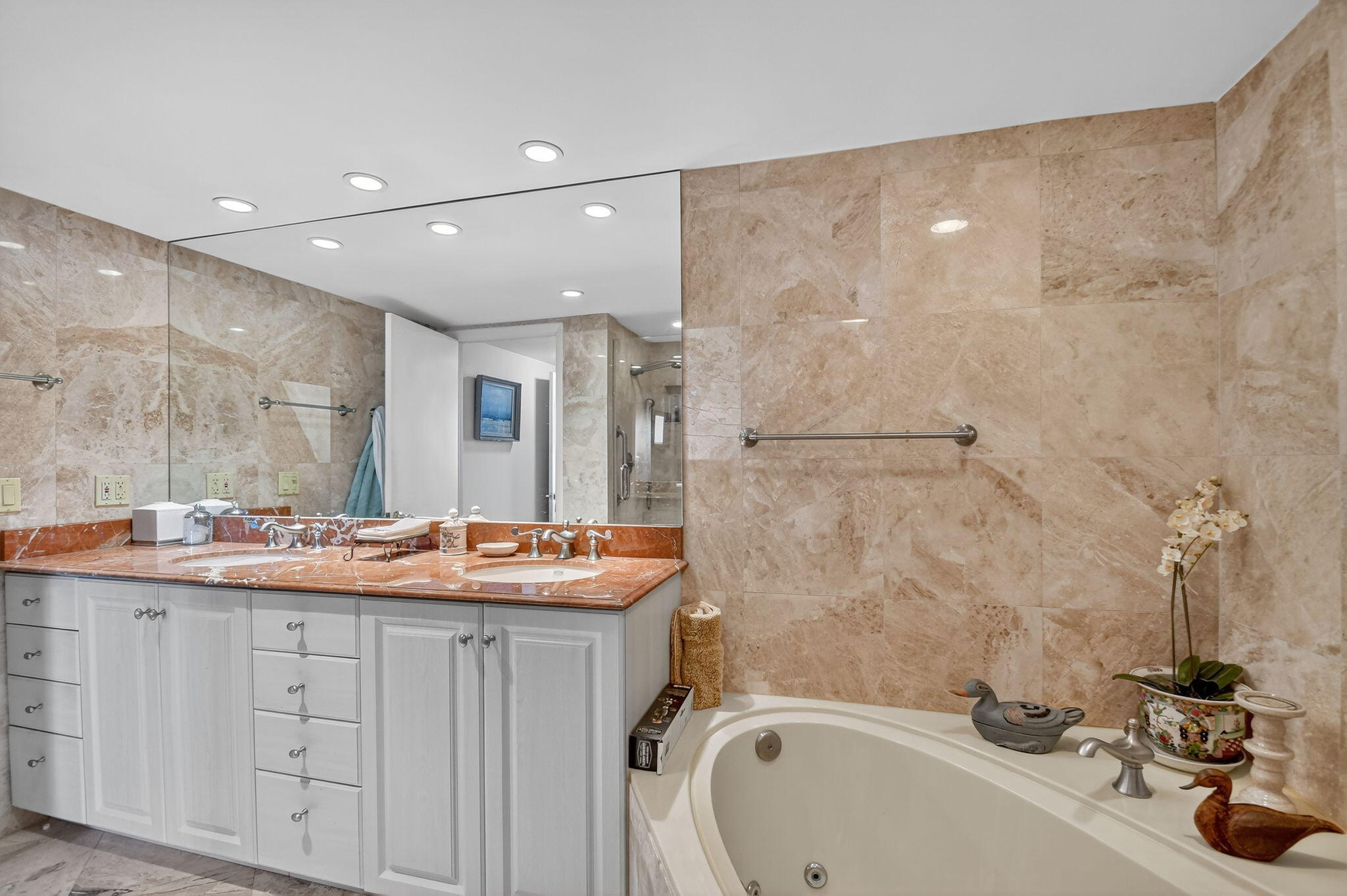 3589 South Ocean Boulevard, Unit 608 South Palm Beach, FL 33480 - Photo 23 of 66 a bathroom with a sink and a mirror