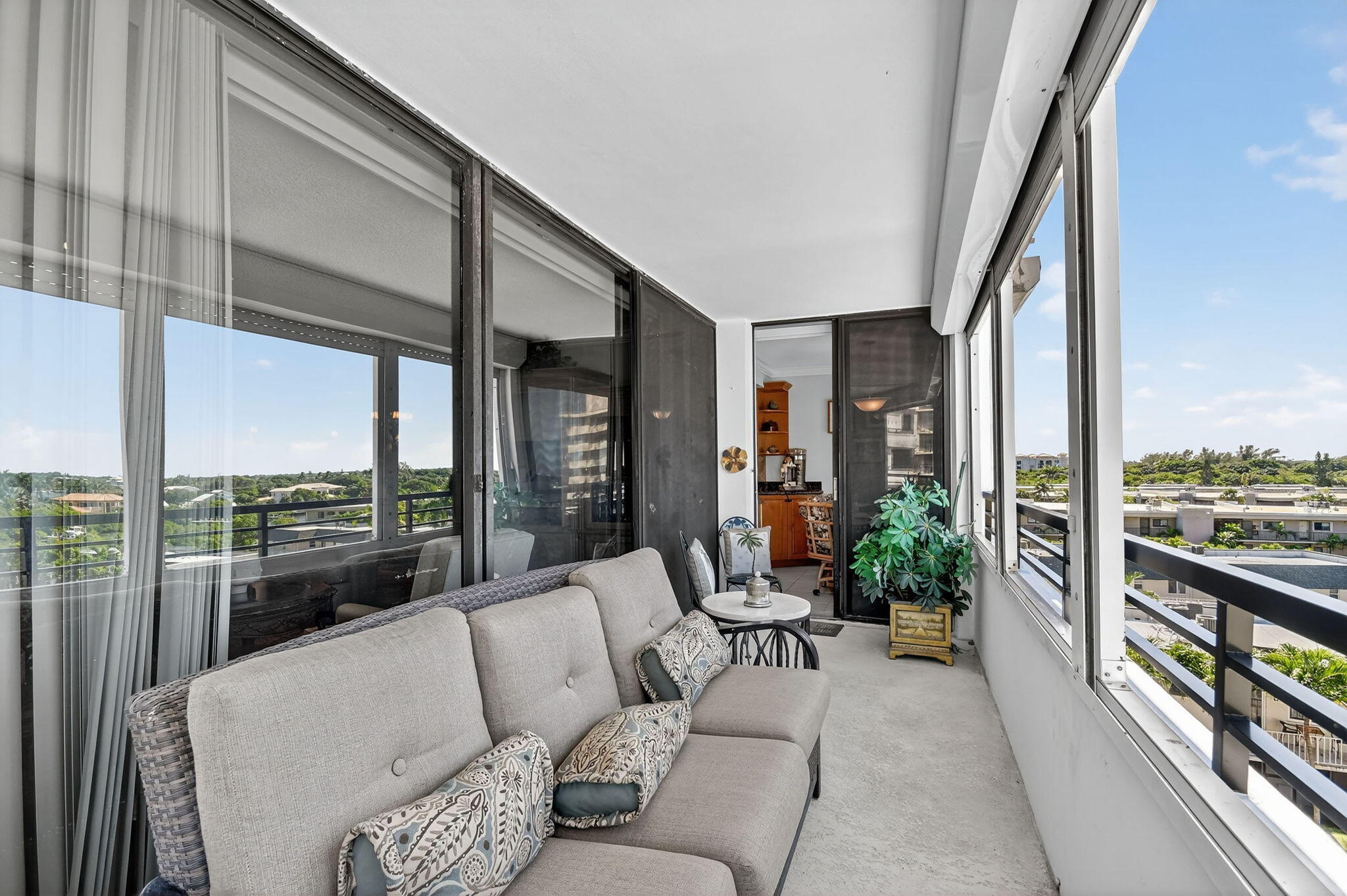 3589 South Ocean Boulevard, Unit 608 South Palm Beach, FL 33480 - Photo 36 of 66 a living room with furniture and a floor to ceiling window